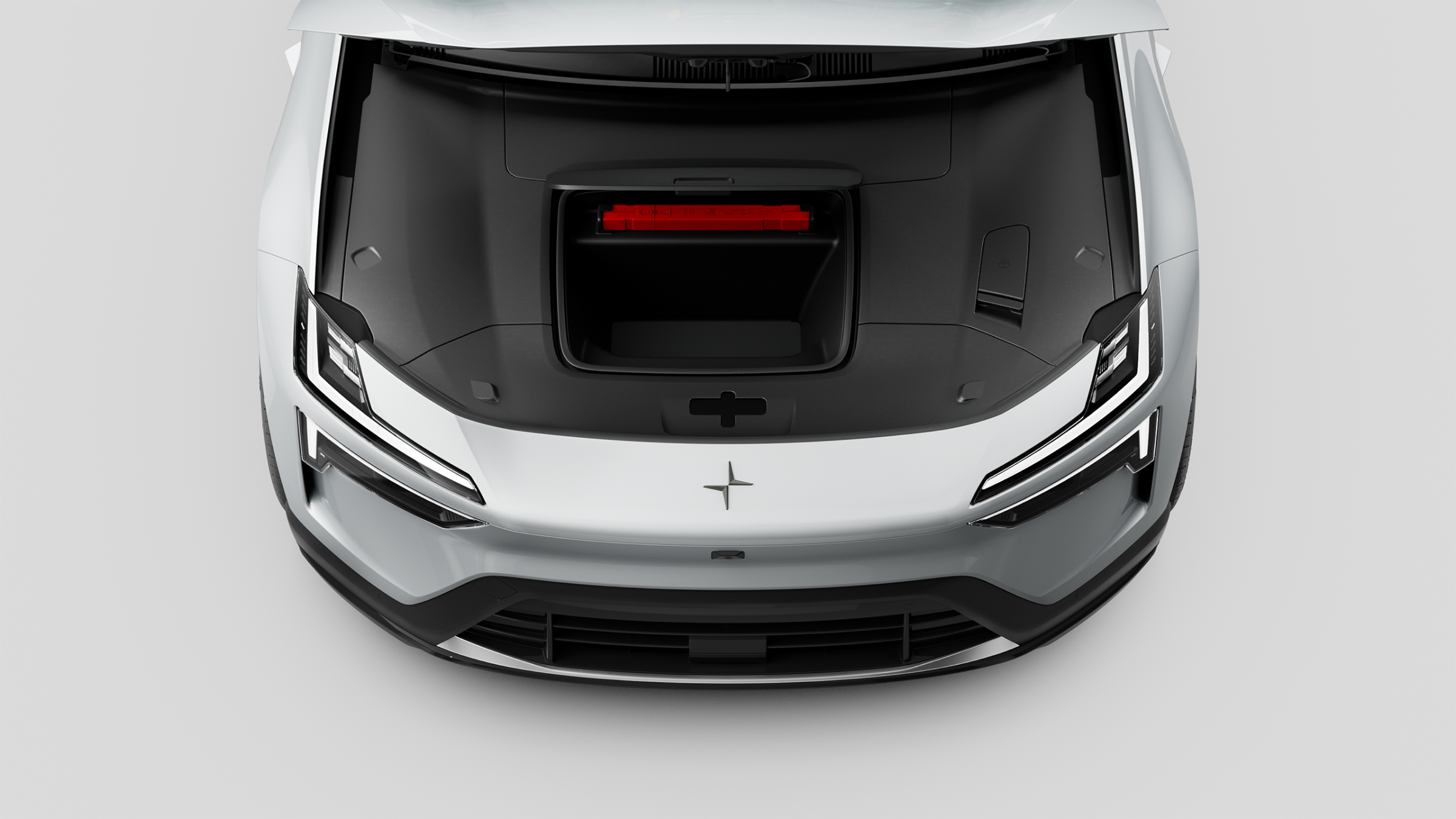 A top down view of Polestar 4 SUV’s front compartment with roof raised up.